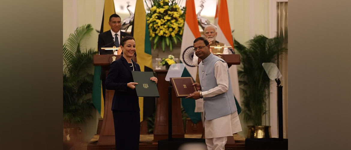  Senator the Houn'ble Kamina Johnson Smith, Minister of Foreign Affairs and Foreign Trade of Jamaica Exchanging two MOUs on Sports and Cultural Exchnage Programme with H.E. Mr. Pankaj Chaudhary, Minister of State for Finance.
